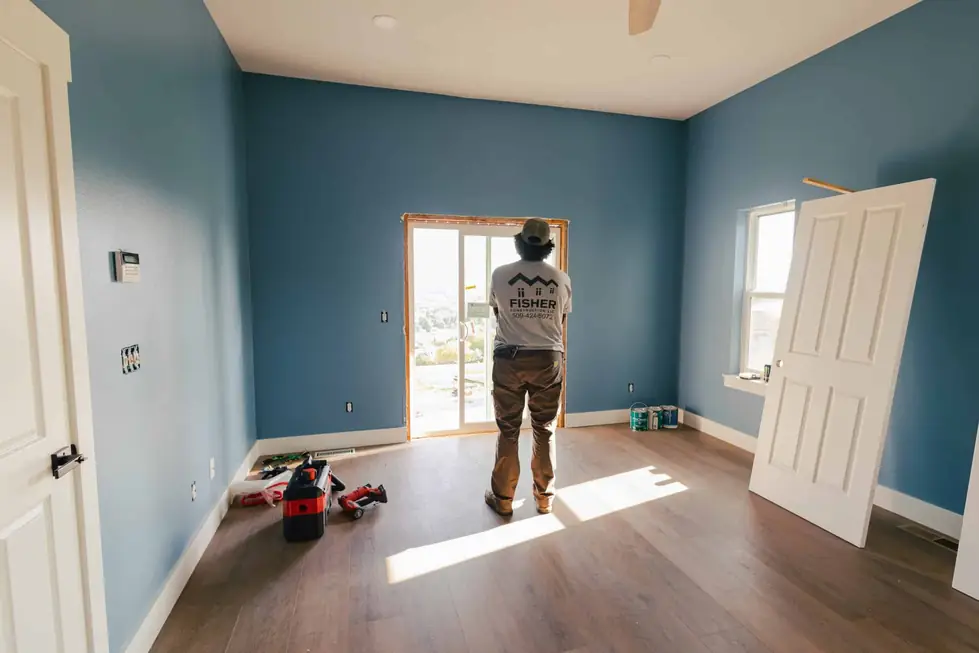 Interior room with freshly painted blue walls in a Fisher Construction project